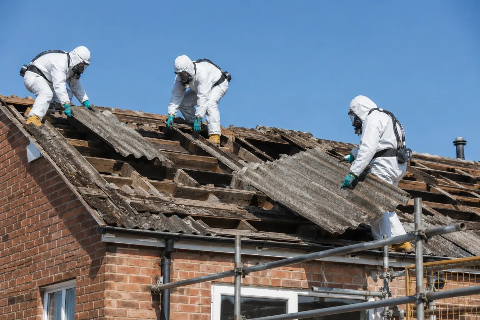 Asbestos remediation team wearing protective PPE
