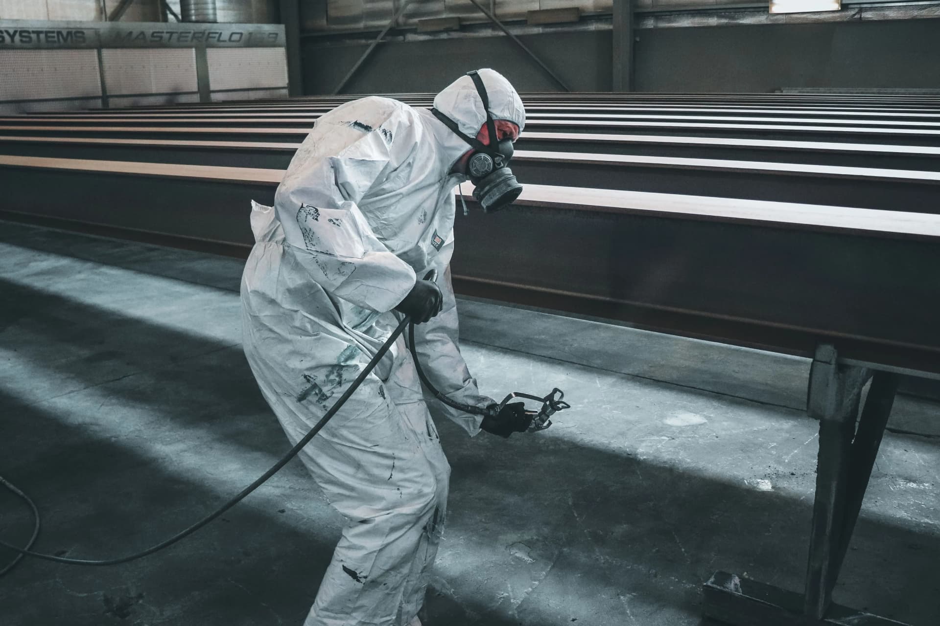 Worker wearing protective equipment during asbestos removal