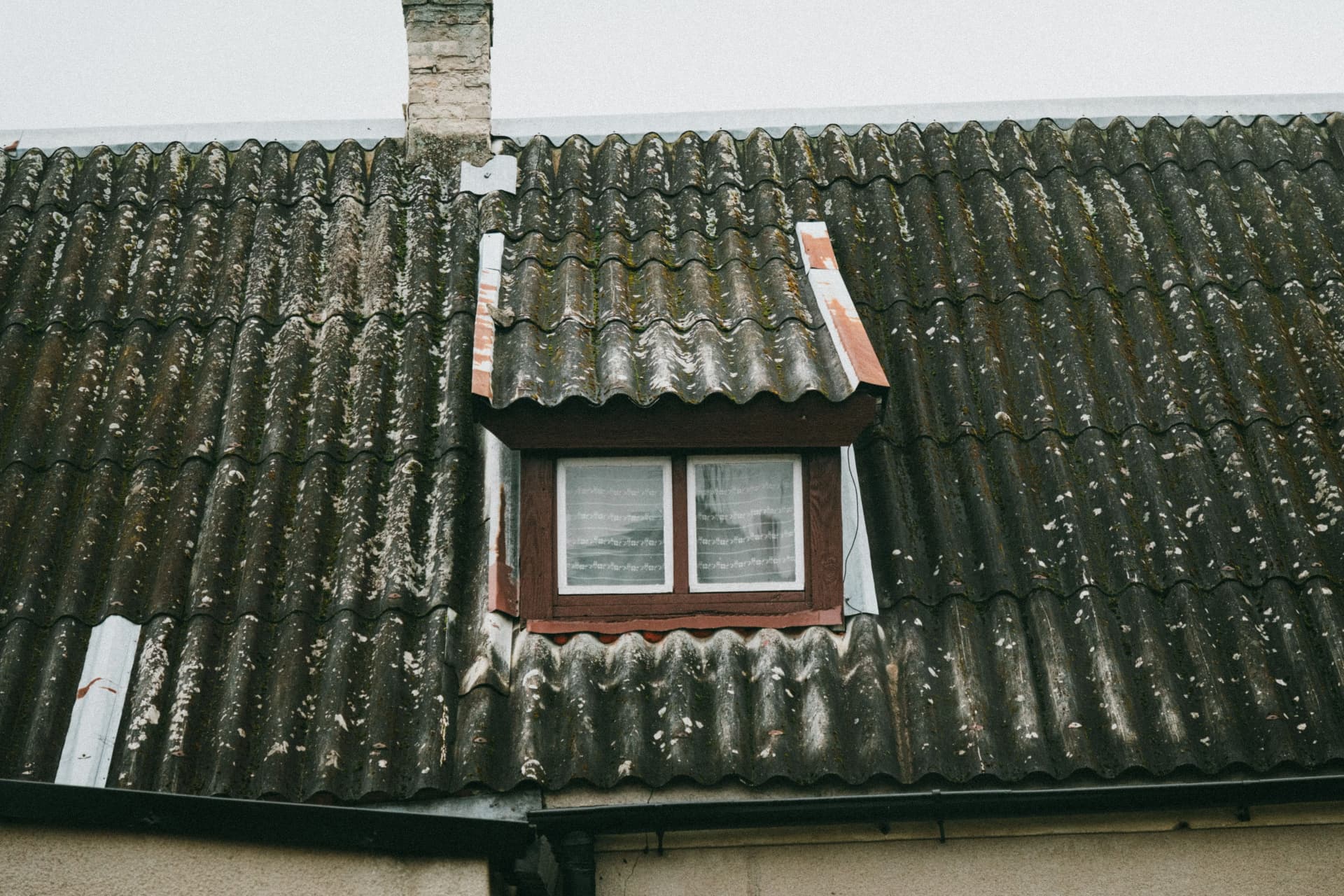 Specialist carrying out an asbestos survey inside a building