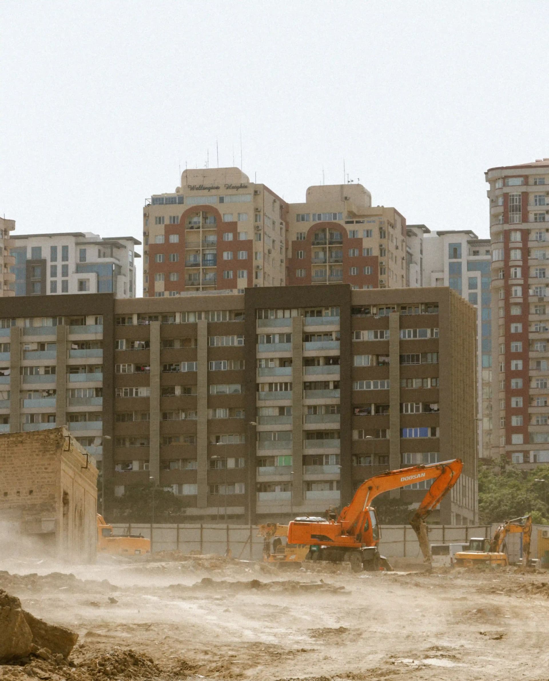 Building structural demolition with professional equipment and site controls