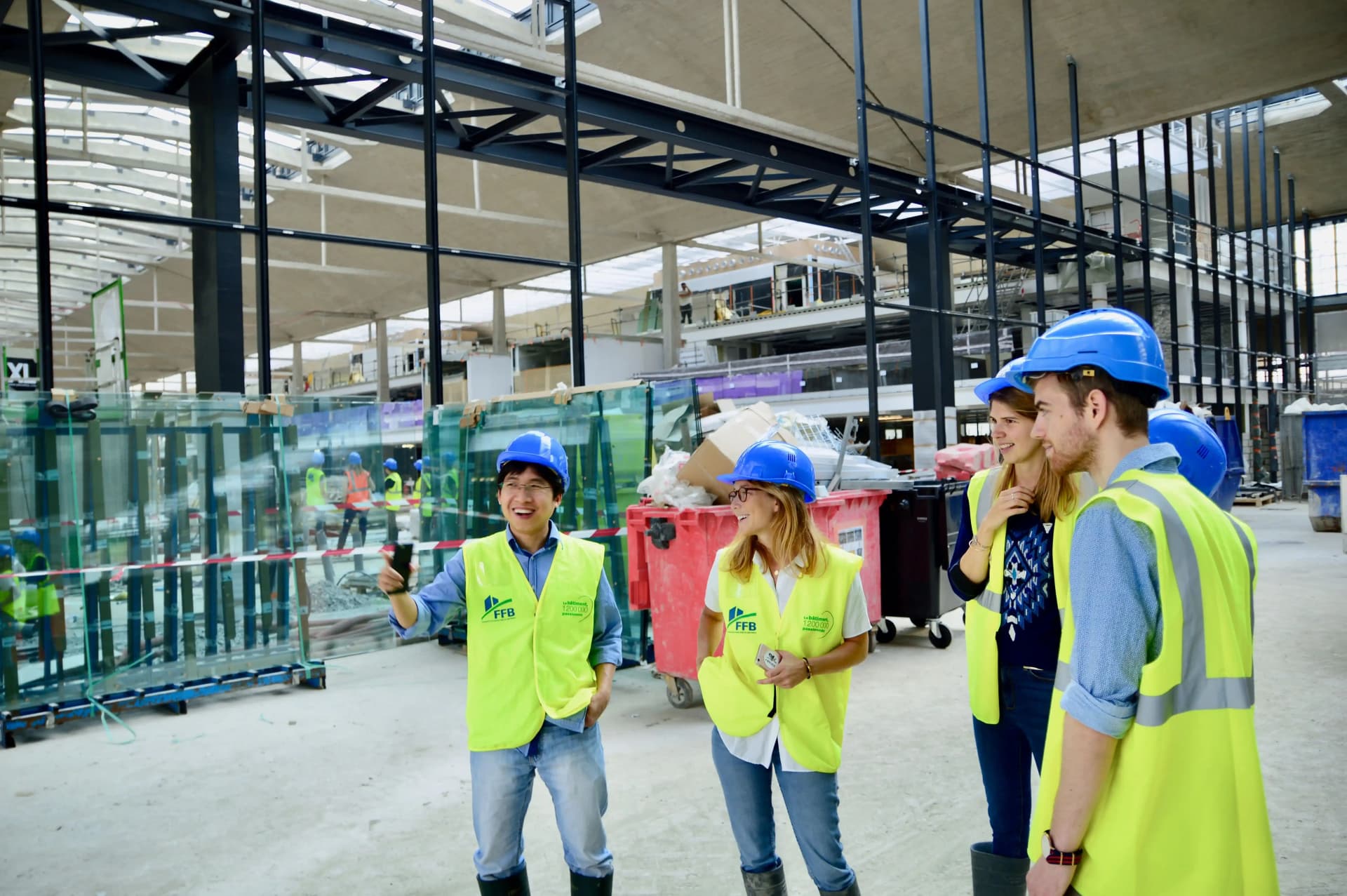 Professional site team coordinating façade retention and construction works