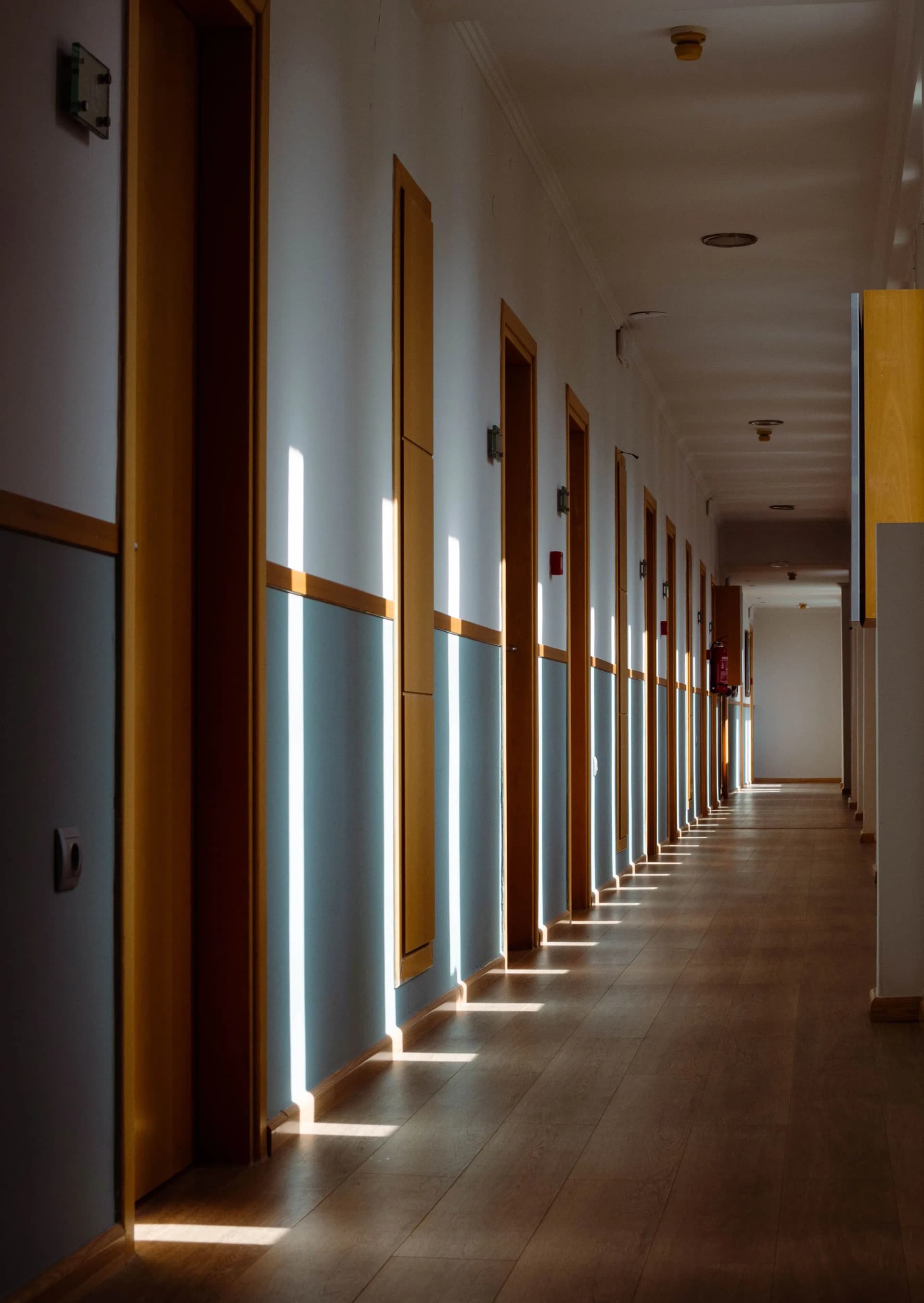 Fire alarm system visible in a building hallway