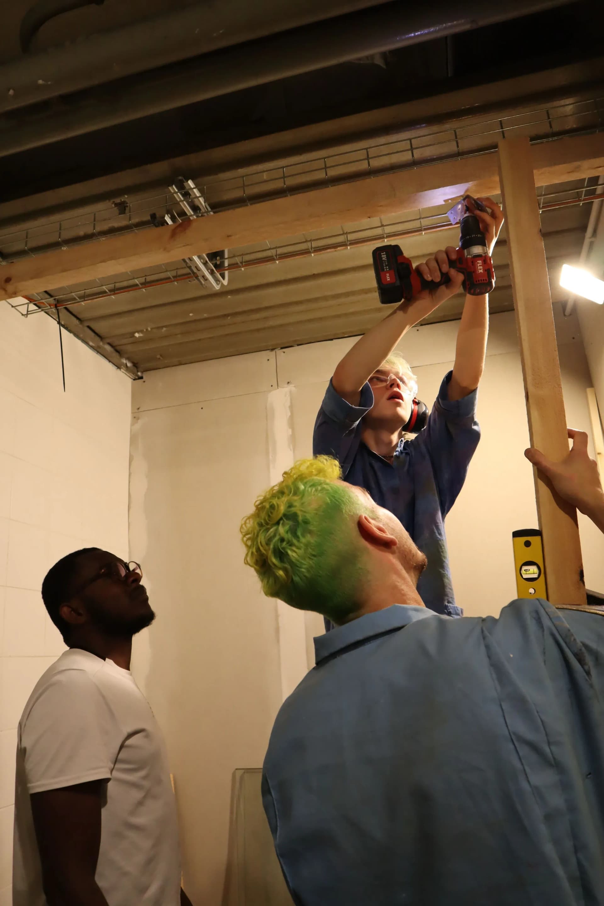 Professionals installing a fire sprinkler system