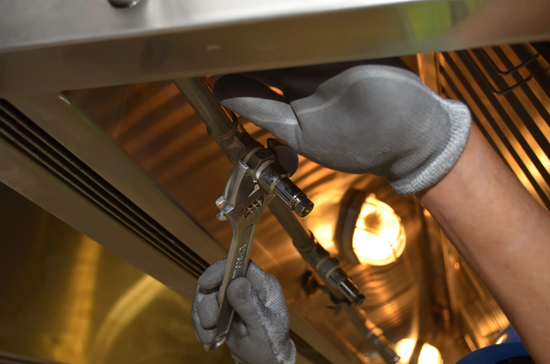 Professional fitting a fire sprinkler system ceiling sprinkler