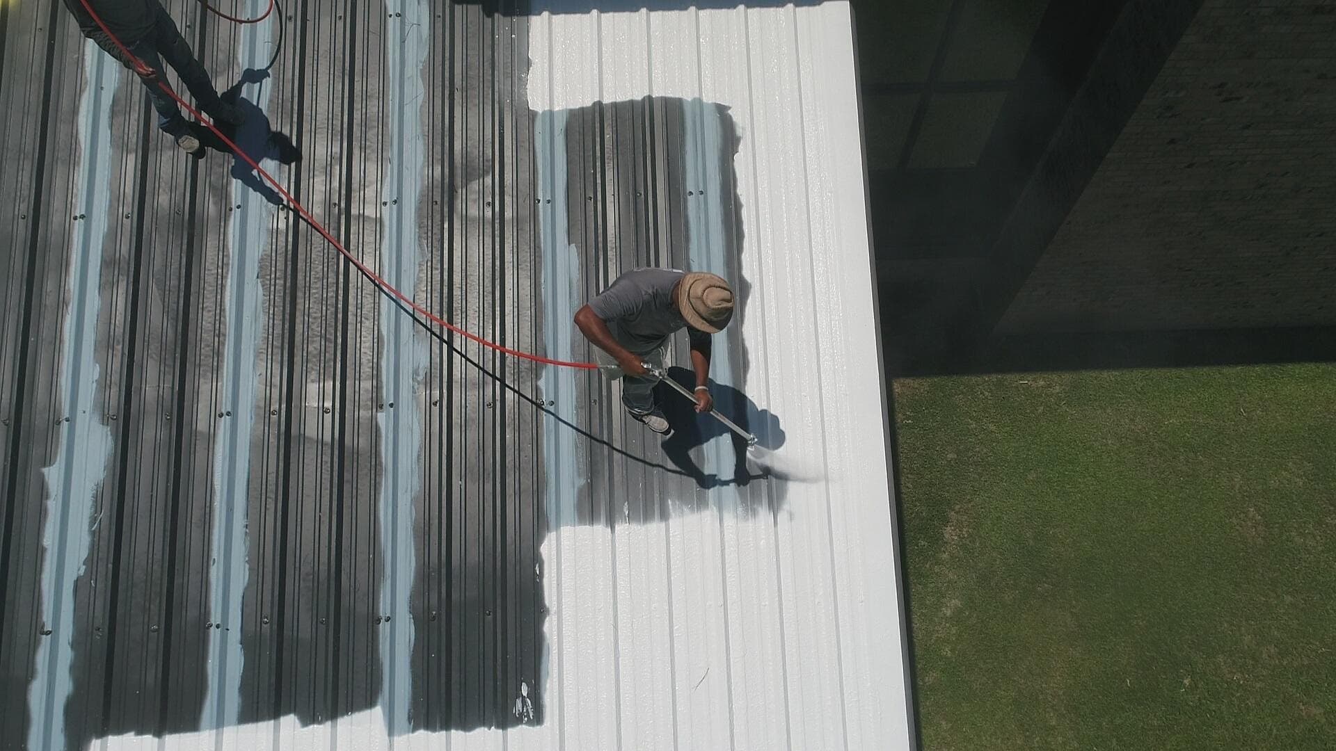 Industrial coating being applied to plant equipment in a UK industrial facility.