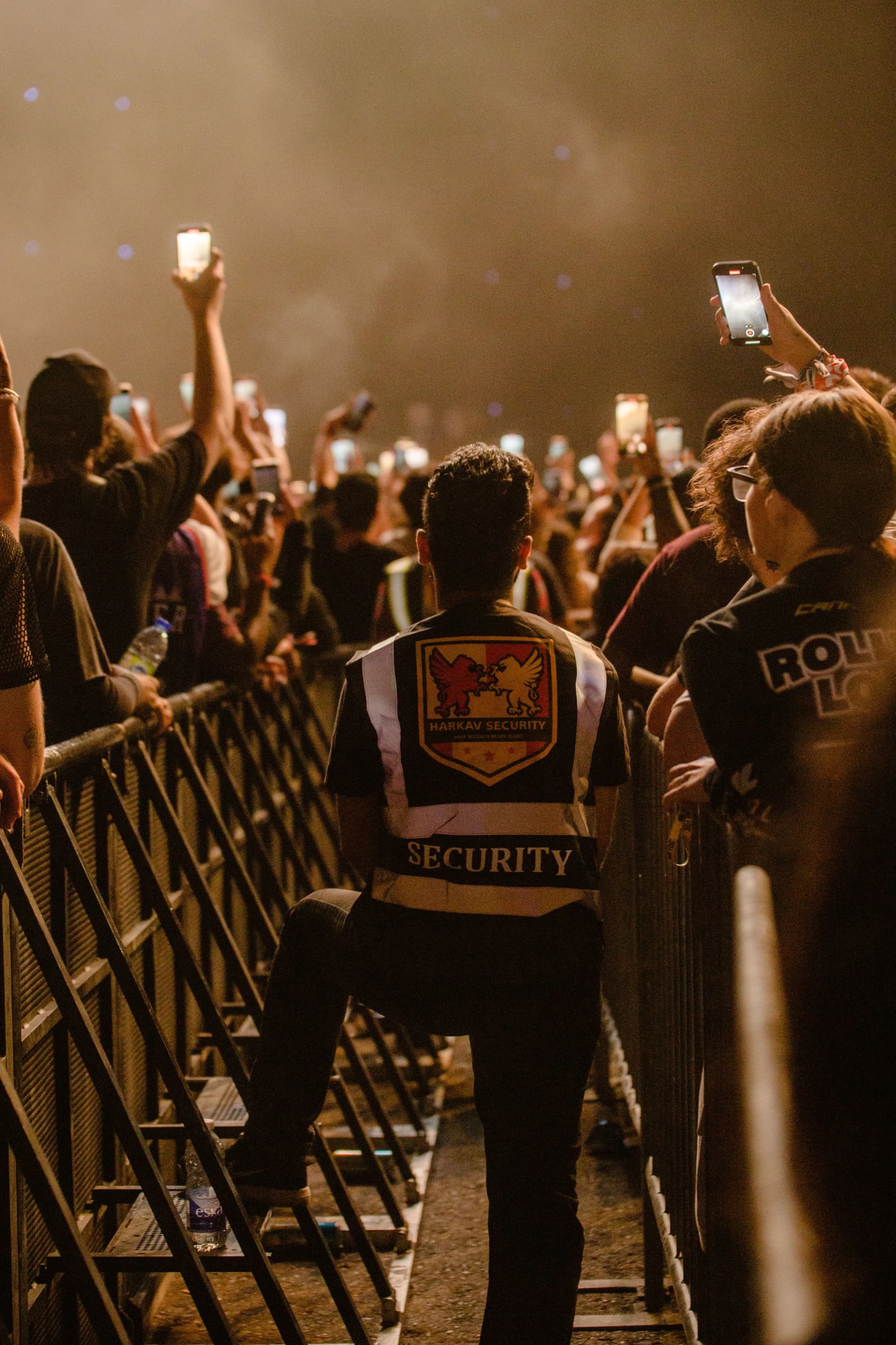 Security guard providing manned security at a concert