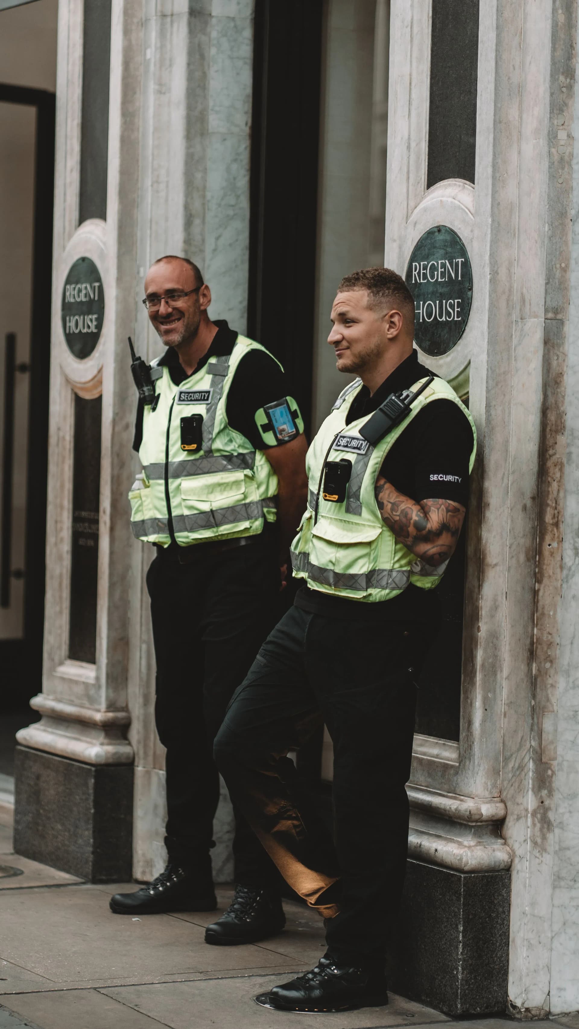 Two security guards discussing site security