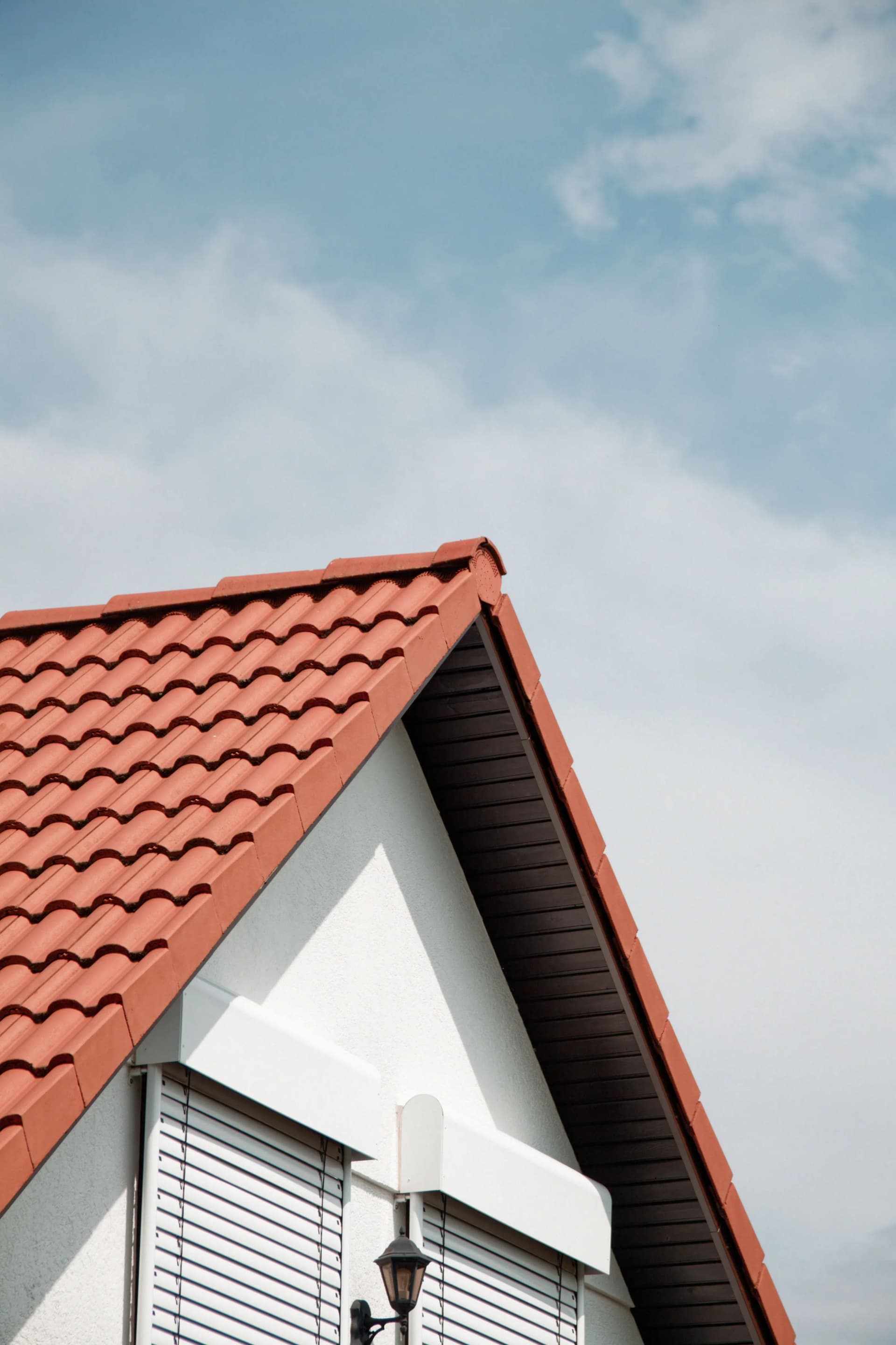 Roofer installing materials on a pitched roof