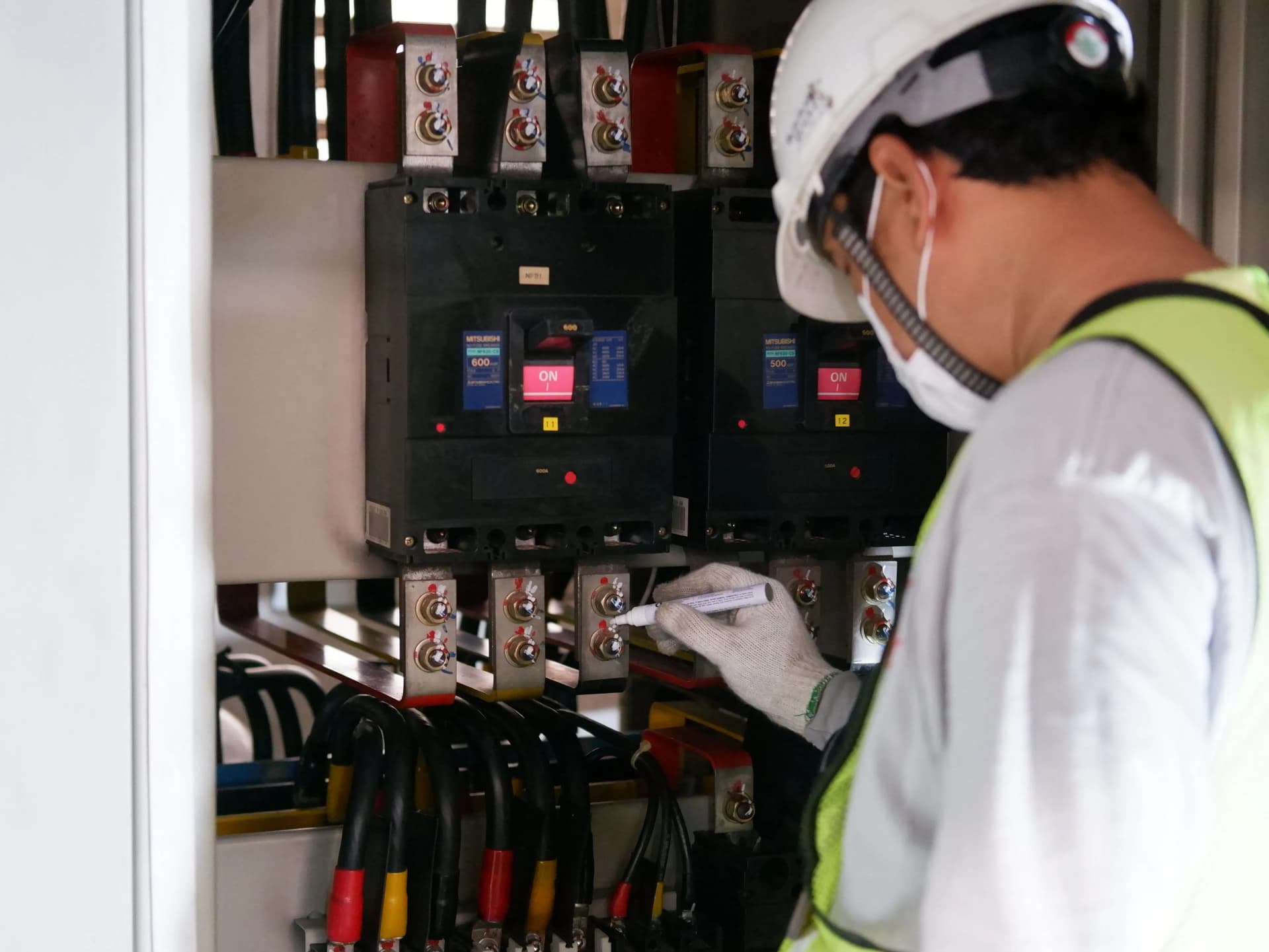 Maintenance engineer inspecting electrical equipment as part of planned preventive maintenance