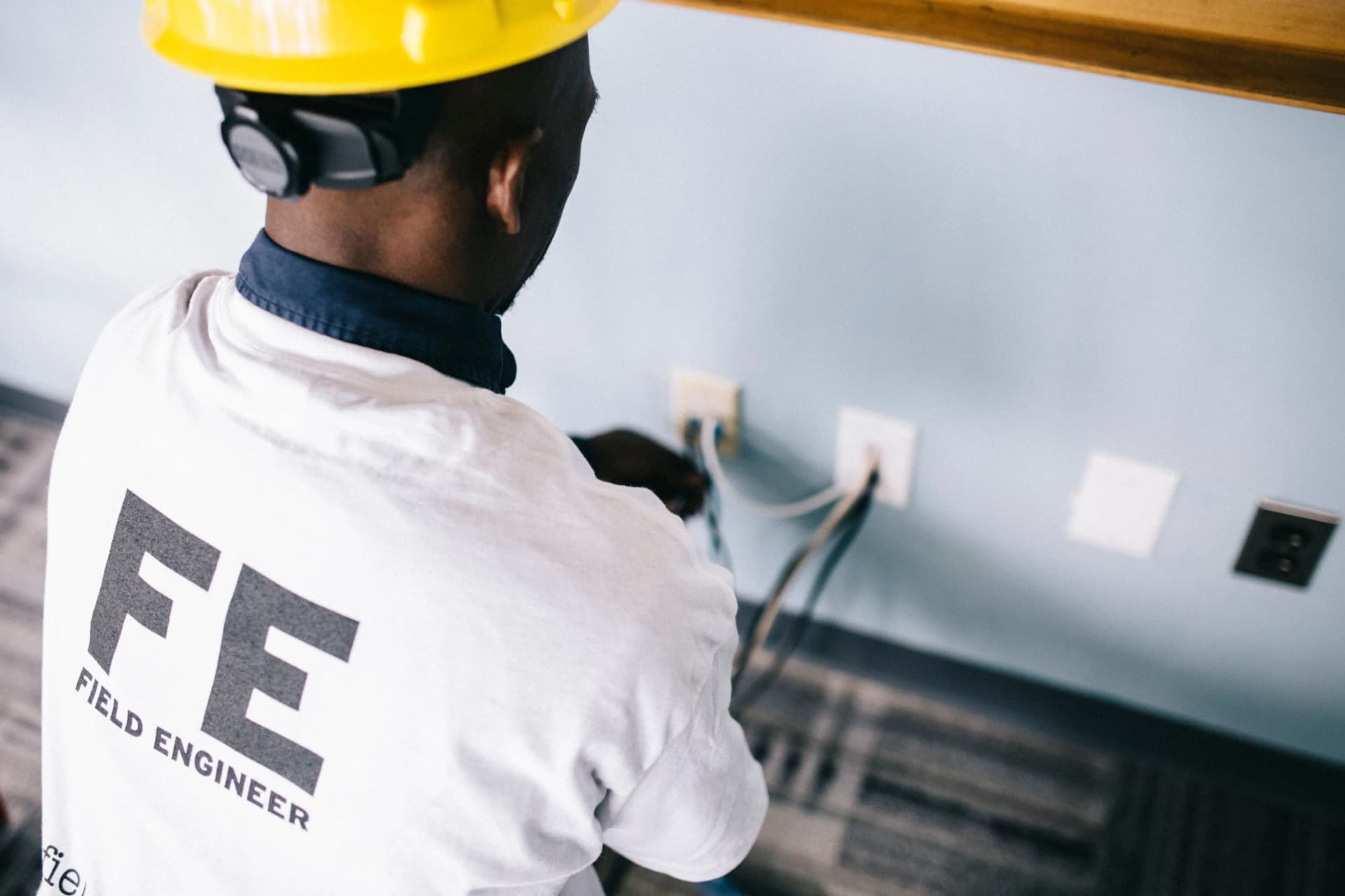 Professional installing a fire alarm system