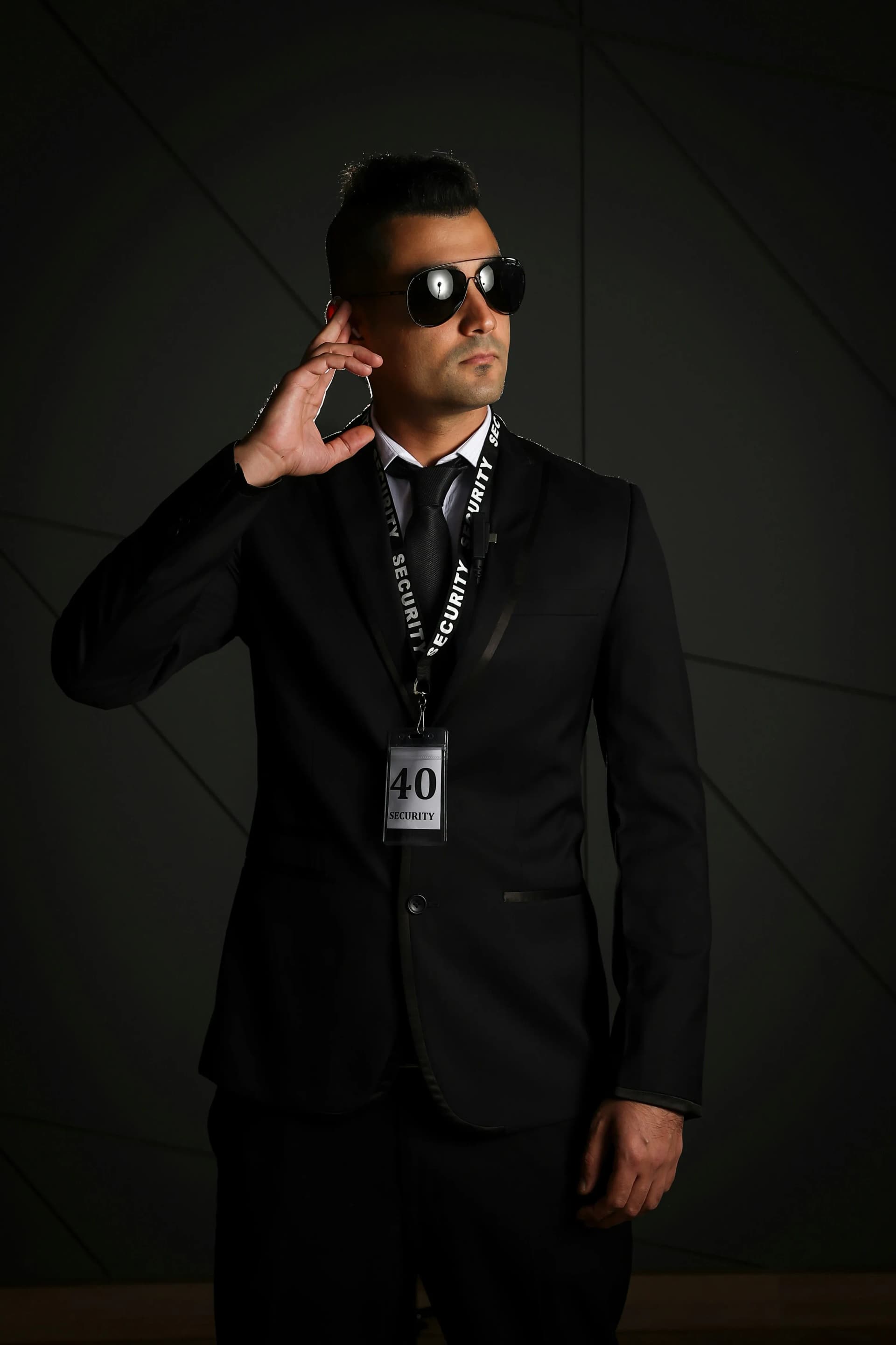 Professional security guard in a black suit