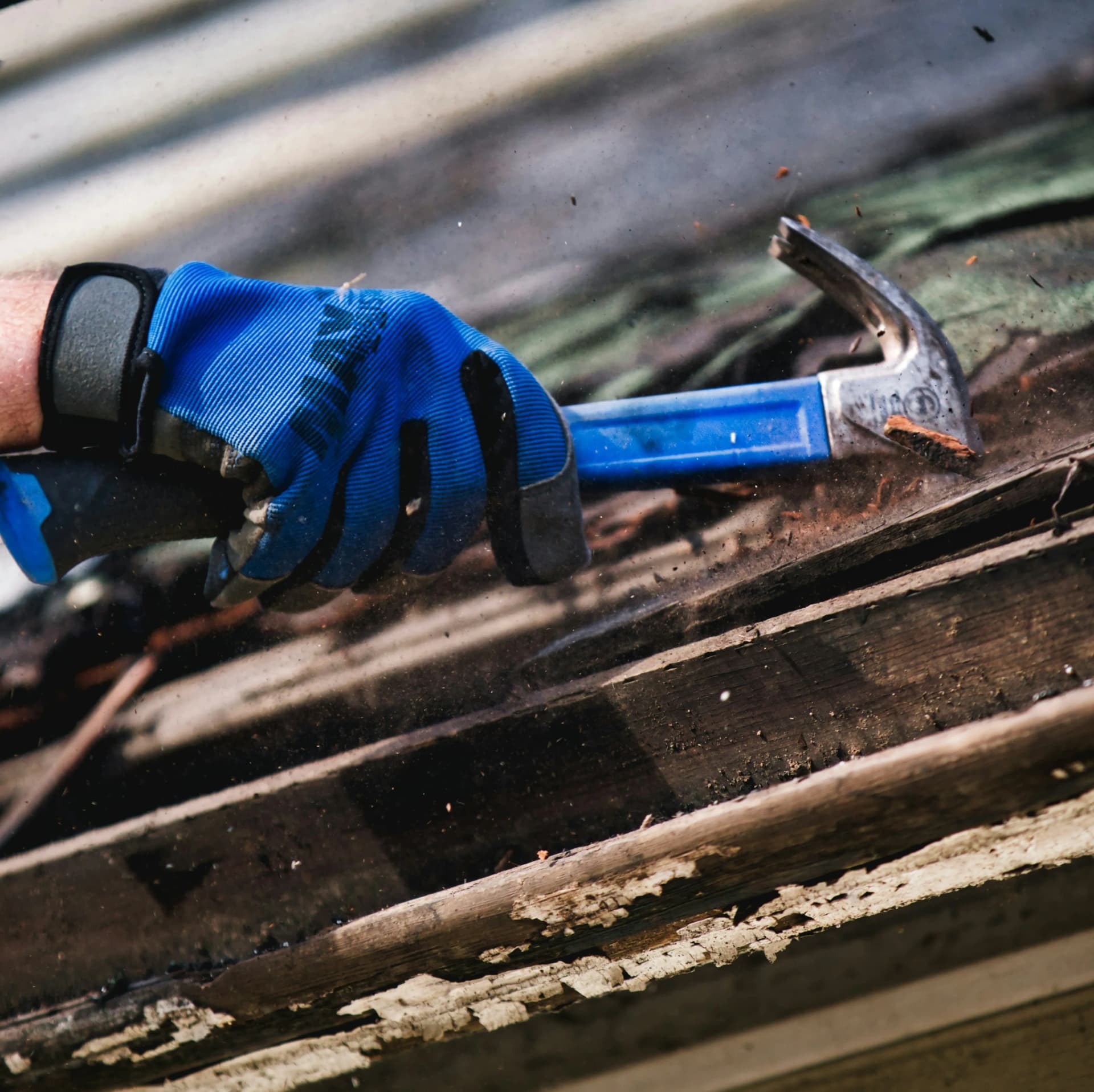 Roofing professional carrying out routine maintenance work