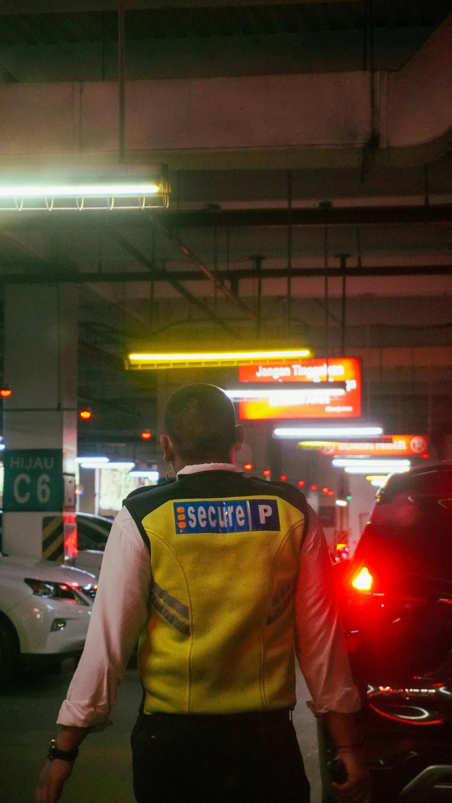 Security officer overseeing a car park during patrol