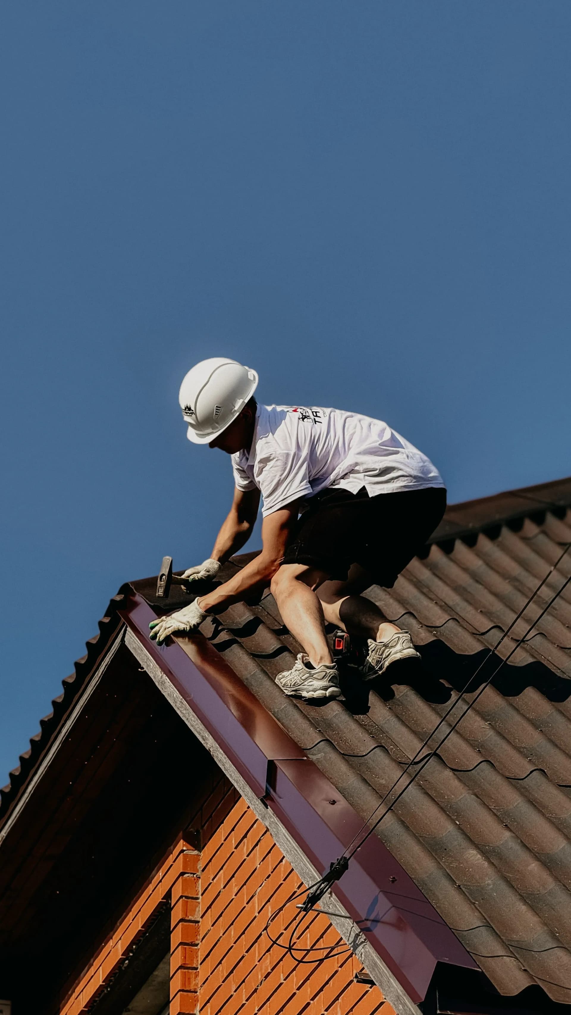 Sloped roof structure with professionally fitted roofing materials