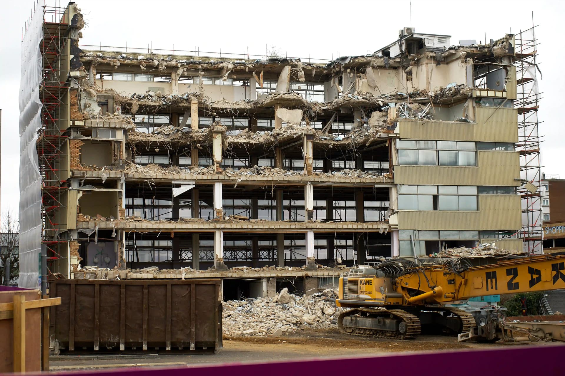 Structural building demolition using specialist demolition equipment