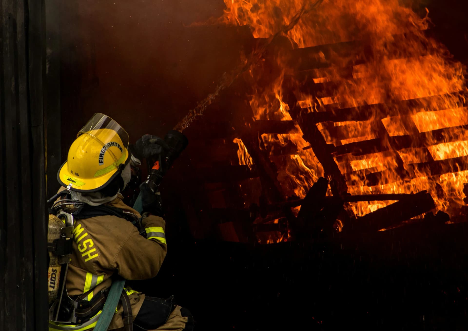 A worker controlling fire from spreading.